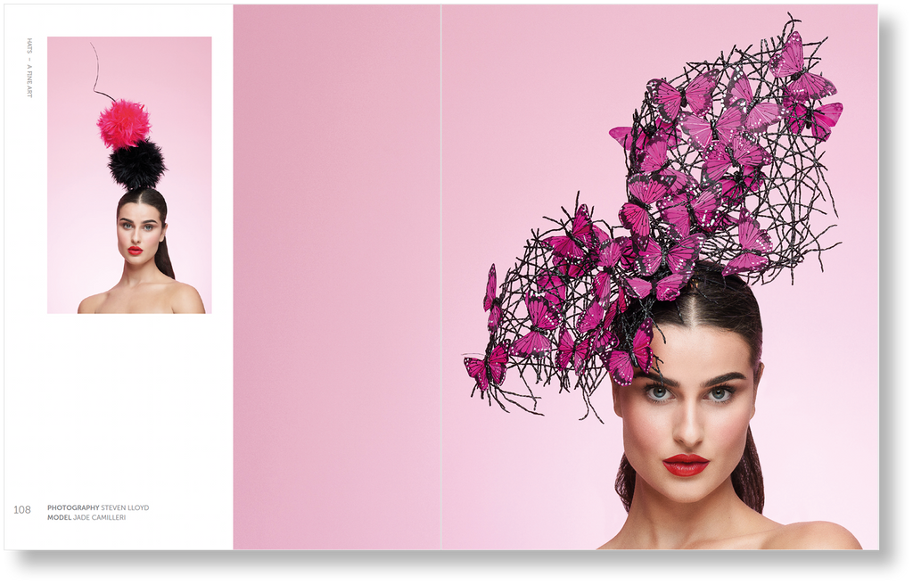 Woman wearing a headpiece with pink butterflies against a pink background